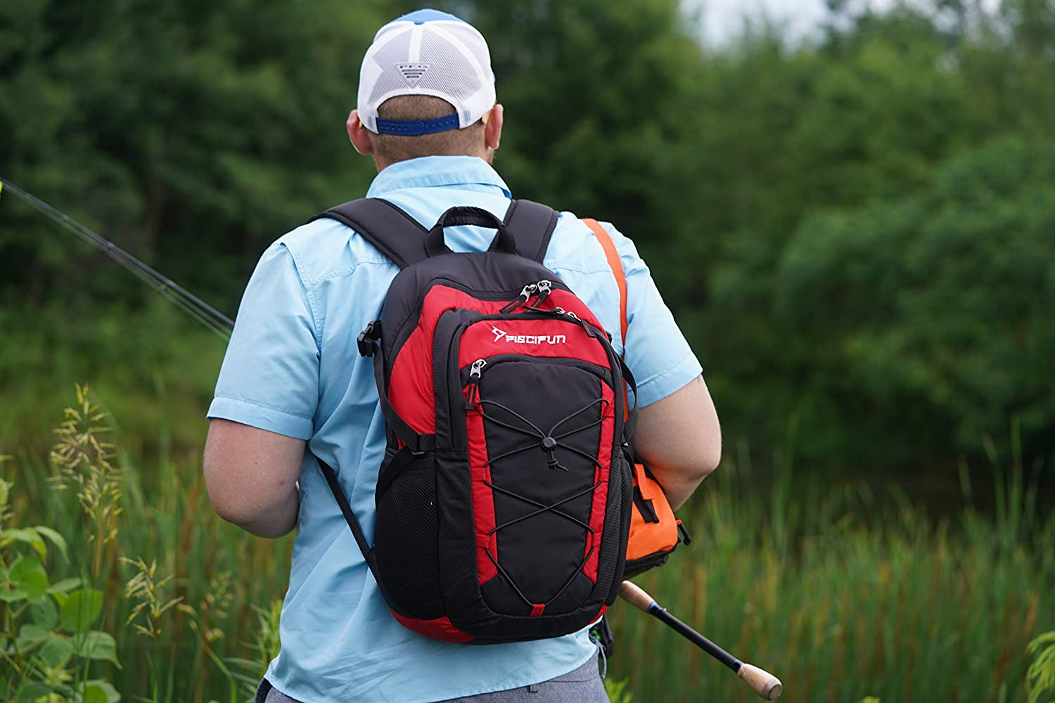 man with backpack fishing